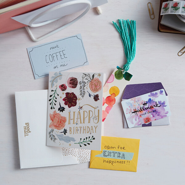 Greeting card with tuck in gifts on a white background