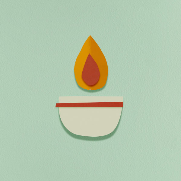 A paper cut candle shape on a mind colored background