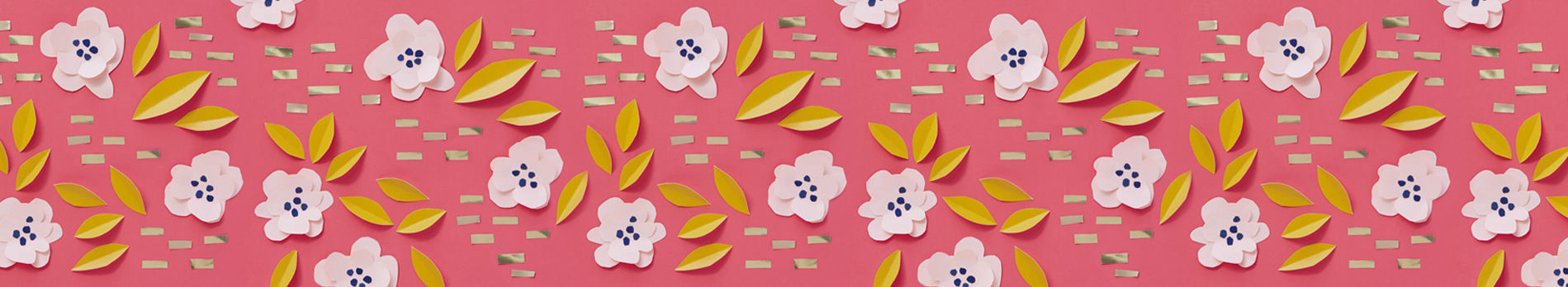 Spring background with paper cut flowers and leaves on a dark pink background