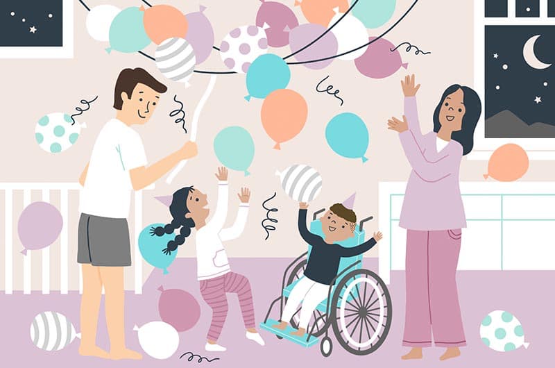 An illustration of a family with a little boy in a wheelchair, celebrating New Year's Eve with a balloon drop in their home.
