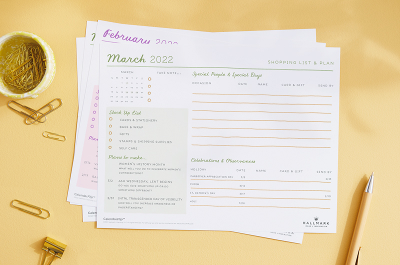 The March celebration planner page on a desktop, surrounded by small office supplies.