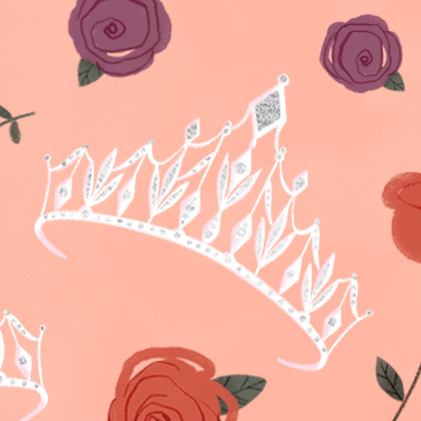 A quinceañera tiara surrounded by roses on a peach colored background.