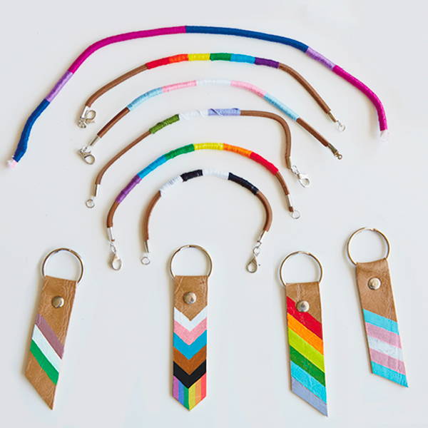 DIY Pride Month keychains and bracelets in a variety of colored stripes symbolizing different parts of the LGBTQ community.