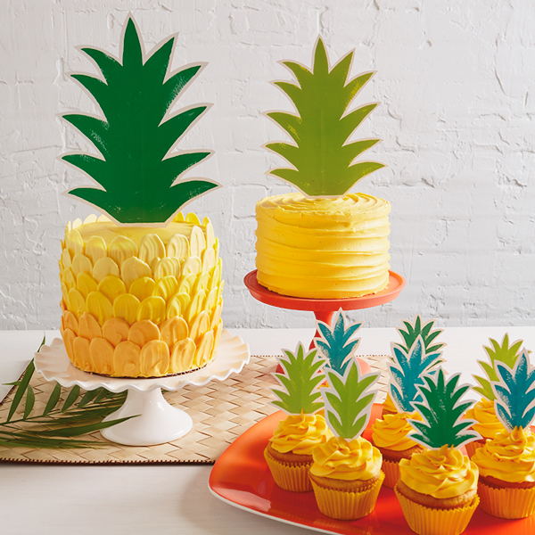 Cakes and cupcakes decorated to look like pineapples with our pineapple top printout.