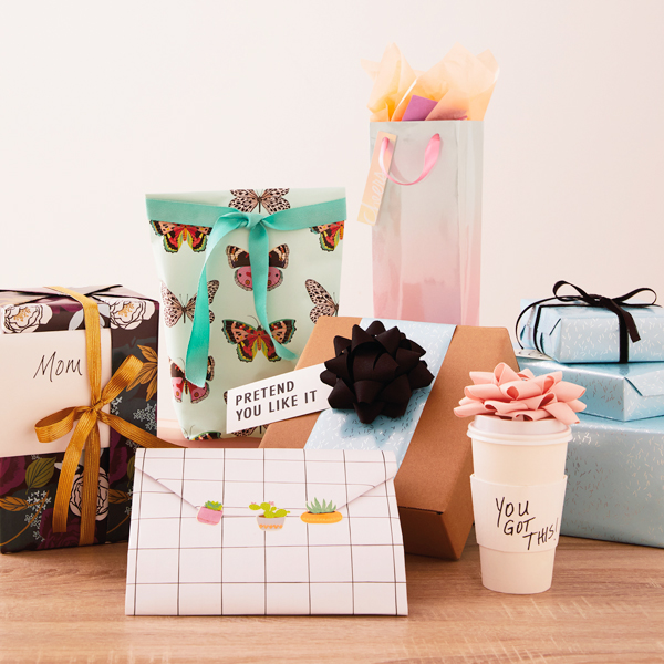 A collection of gifts wrapped creatively with various gift wrap hacks.
