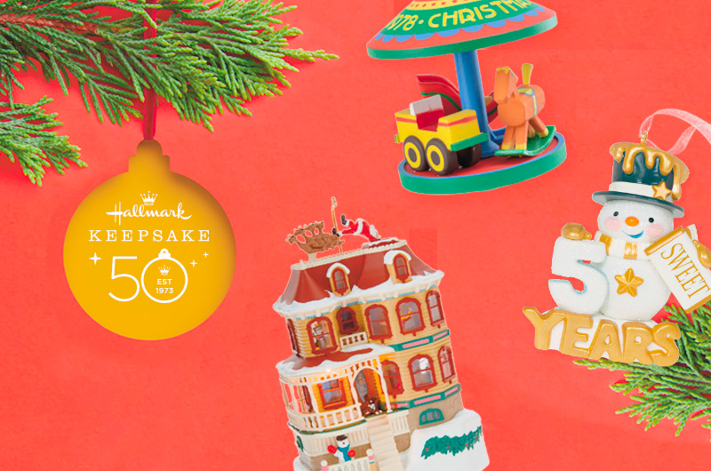 A trio of Keepsake Ornaments, one depicting a 50th Anniversary Snowman, a Victorian house with Santa and his sleigh on the roof, and a children's toy carousel.