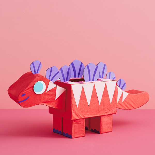 A valentine box shaped like a red, pink and purple stegosaurus.