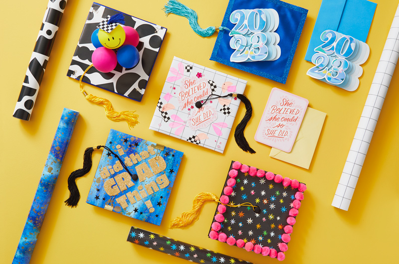 A variety of graduation caps decoration ideas using Hallmark wrapping paper and cards.
