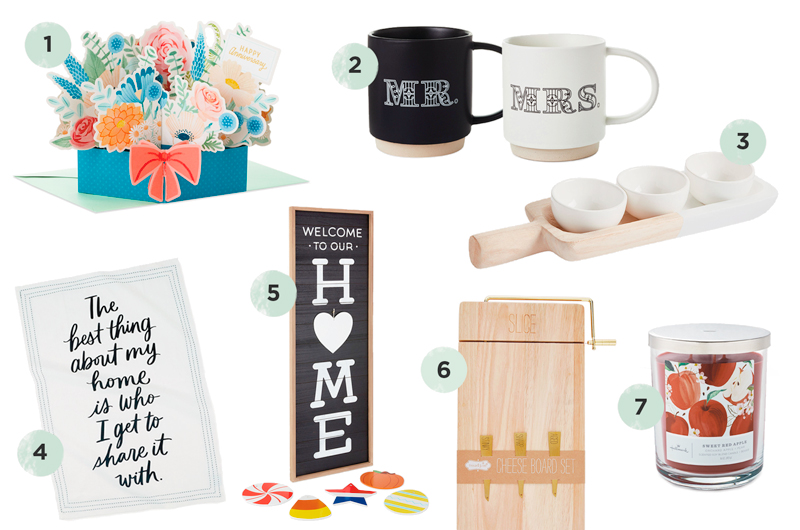 A selection of household-themed anniversary gift ideas, including a floral pop-up card, a mug set that read, 