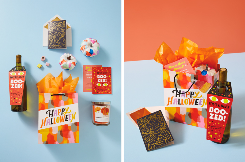 A boozy boo basket idea for friends includes a bottle of wine with our free printable attached, some hand painted mini pumpkins, a Jack Skellington ornament, an heirloom pumpkin scented candle, and a Halloween card with gold foil spiderwebs featured on the front with the message, 