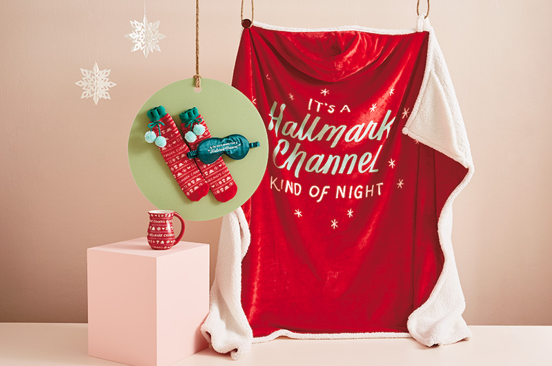Hallmark Channel gift ideas for the self-care specialist include a throw blanket, fuzzy socks and eye mask set, and holiday mug.