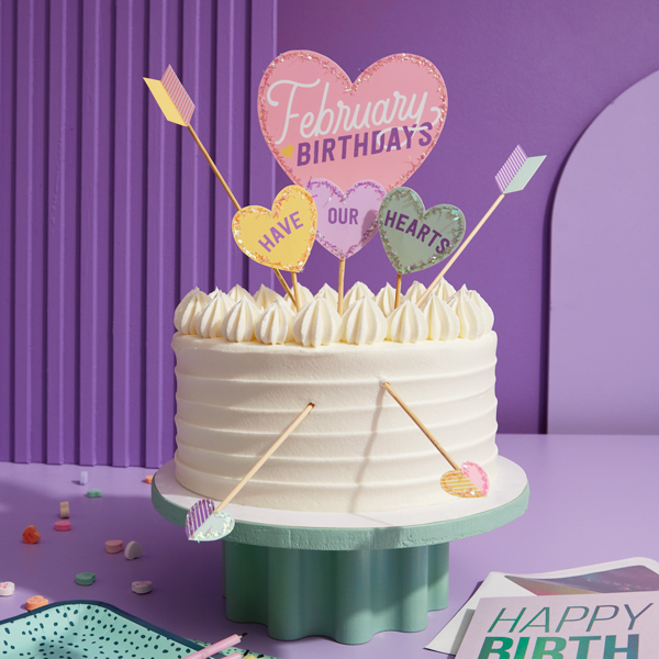 A birthday cake with a topper that says, 