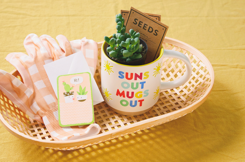 A gardening-themed mug gift bundle that includes a ceramic mug with the saying 