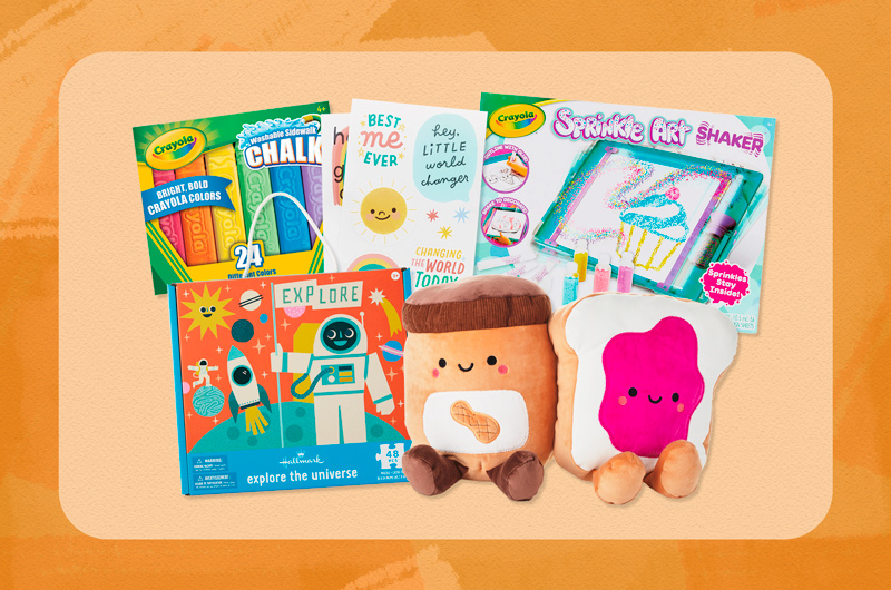 An assortment of kindergarten graduation gifts, including chalk, stickers and Better Together plush.