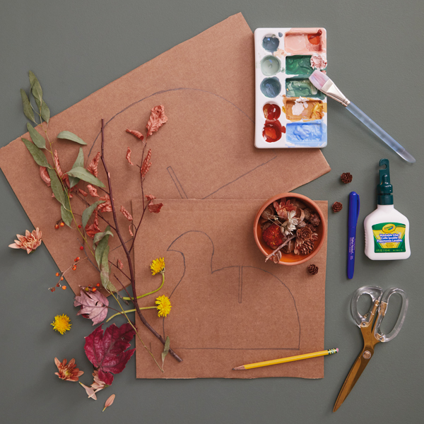 Supplies needed to make the DIY Thanksgiving turkey centerpiece include pieces of cardboard, foraged fall items like fallen leaves, dried flowers, acorns, grasses, etc., craft paint and paint brush, scissors, a pencil, a black permanent marker and craft glue.
