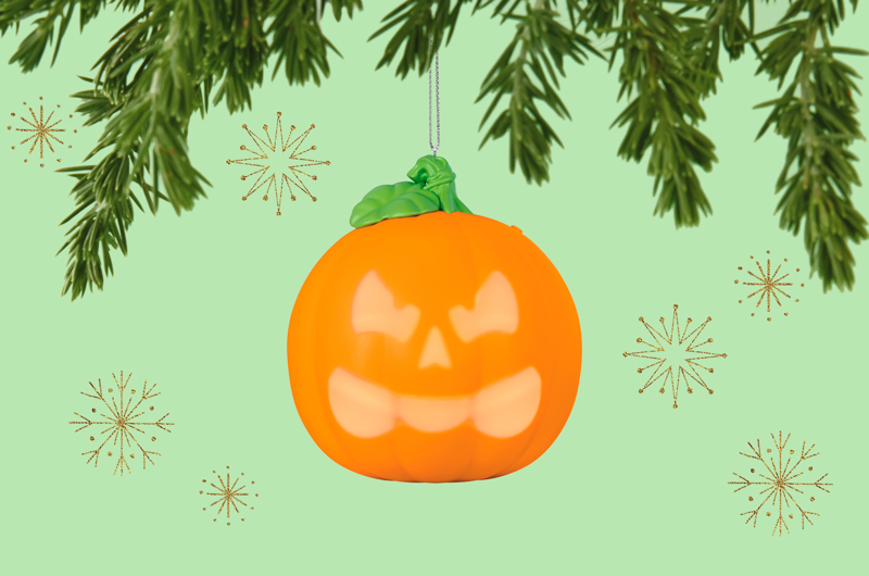A Keepsake Ornament that looks like a pumpkin; when a button on the top is pressed, a series of jack-o-lantern faces light up on the front of the pumpin.