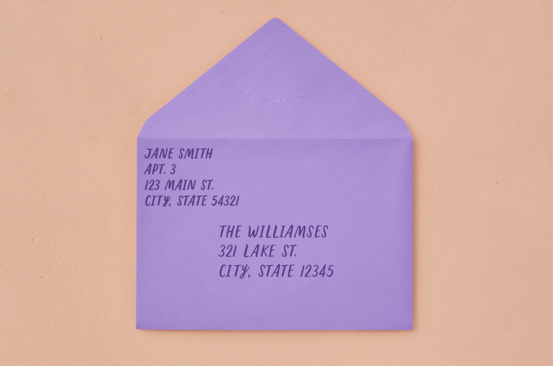 A light purple envelope addressed to a family