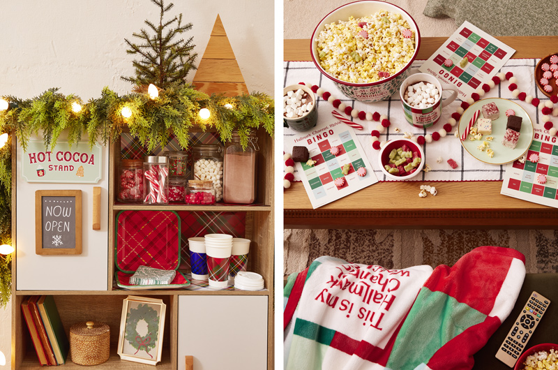 A hot cocoa station is stocked with paper cups, red plaid-patterned paper plates, and holly patterned paper napkins; the station is also stocked with jars of cocoa garnishes like candy canes, marshmallows and sprinkles; next to this is a Hallmark Christmas movie bingo setup, complete with a Hallmark Channel fleece throw, and popcorn bucket.