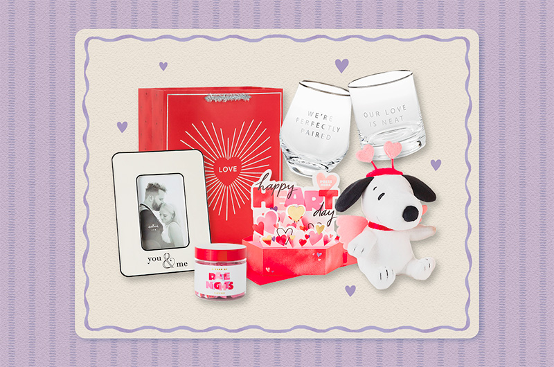 A selection of Valentine's Day gift ideas for him, including a white ceramic photo frame with black border details and the words 