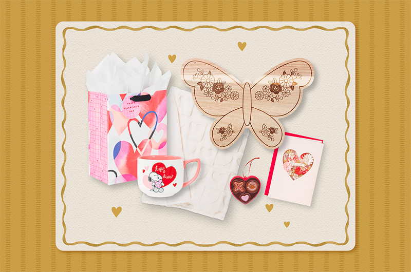A selection of Valentine's Day gift ideas for a mom, which include a butterfly-shaped charcuterie board, an ornament that looks like a small heart-shaped box of chocolates; a mug featuring an illustration of Snoopy holding a heart with a caption that reads, 