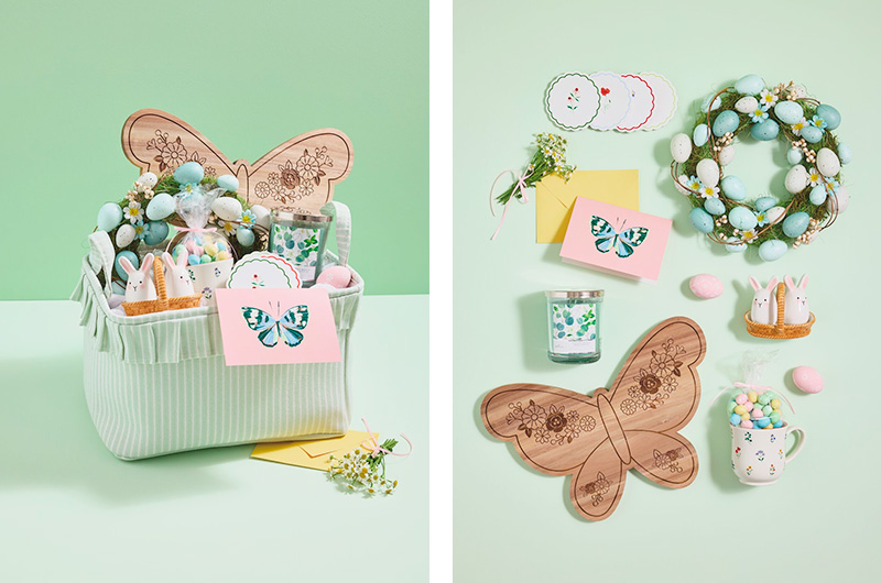 An Easter basket idea for an adult that's spring decor themed; the Easter basket is filled with gifts including a butterfly-shaped charcuterie board, a floral mug, a set of ceramic salt and pepper shakers in the shape of white bunnies, a decorative wreath covered in pastel eggs and dainty florals, a set of four floral coasters, a eucalyptus-scented candle, and a card with a butterfly on the front.