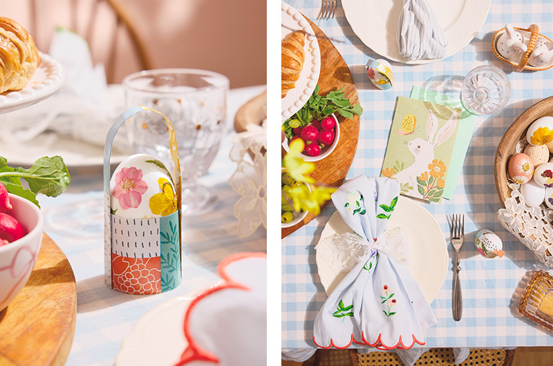 A closeup of a hardboiled egg decorated with pressed, dried flowers sits in a DIY basket or holder made from wrapping paper; a downshot of an Easter table setting on a pale blue and white gingham check tablecloth, with a floral tea towel tied with lace as a napkin; also on the table are vintage-inspired bunny-shapped salt and pepper shakers, and a wooden bowl filled with hardboiled eggs that have been decorated by gluing on pressed, dried wildflowers.