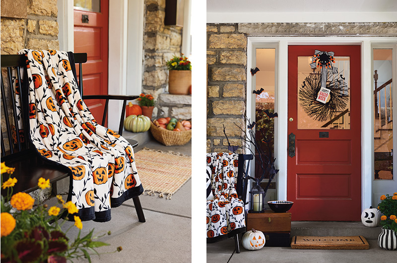 Two home decor setups for a front porch are shown side by side; the setup on the left is set up with fall decor and shows a black wooden bench with a jack-o-lantern patterned throw blanket draped over it, with a variety of fall flowers and gourds positioned nearby and around the front door; on the right is a demonstration of how that same bench and blanket can work in a Halloween decor setup, with the fall gourds and flowers swapped out for more overtly Halloween decor items, like jack-o-lanterns, a black branch and black silhouettes of bats, and a black wreath hanging on the front door.