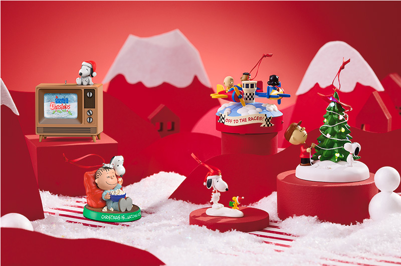 A collection of Peanuts Keepsake Ornaments, featuring beloved characters like Snoopy, Woodstock, Charlie Brown, Linus, Lucy and Franklin.