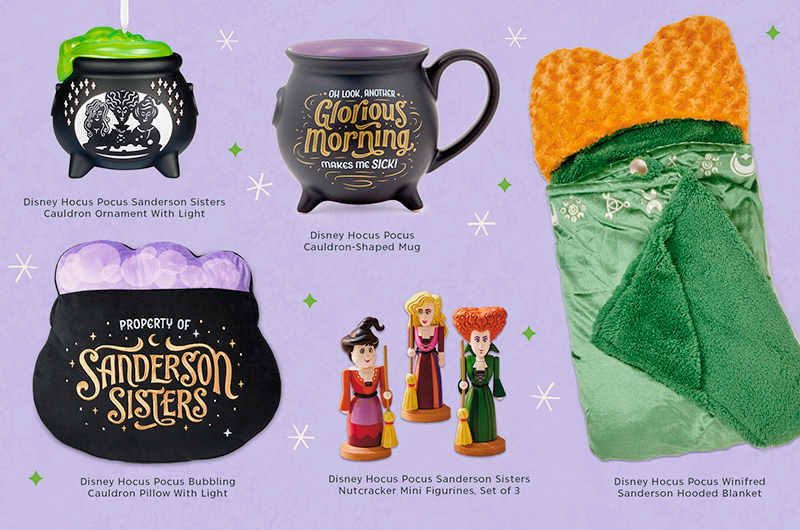 A collection of gifts inspired by Disney Hocus Pocus, including a Keepsake Ornament shaped like a cauldron that features caricatures of the Sanderson Sisters on its side and lights up at the press of a button; a pillow, also shaped like a black witch's cauldron, that reads 