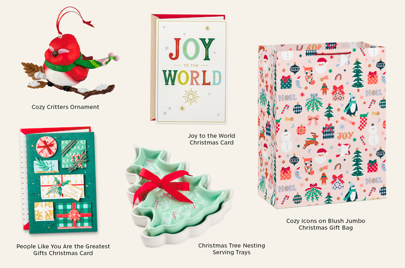 Collection of handcrafted-inspired holiday gifts and décor including a red bird ornament perched on a snowy branch, a 