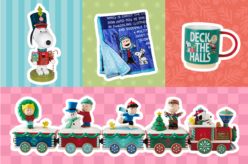 Peanuts holiday merchandise collage featuring a Snoopy nutcracker-style figurine holding a candy cane and gifts, a blue fleece blanket with Peanuts characters and partially readable text, a green mug that reads “DECK THE HALLS” with Snoopy and Charlie Brown illustrations, and a Peanuts Christmas train decoration with multiple festive train cars carrying character figures, a snowman, a Christmas tree, and holiday gifts.