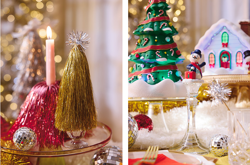 Close-up holiday display featuring DIY tinsel trees in gold, silver, and pink, paired with flameless candles, mirrored ball ornaments, and glass pedestal stands. The left side shows layered decorative accents grouped on a tray, while the right side demonstrates how the same supplies can be used to elevate a Christmas village scene with varying heights, sparkle, and festive texture.